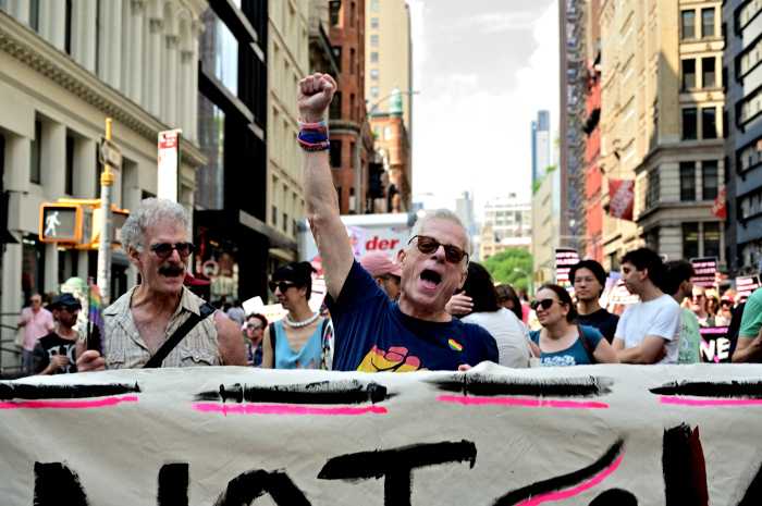 Lee Raines helps lead the Queer Liberation March.