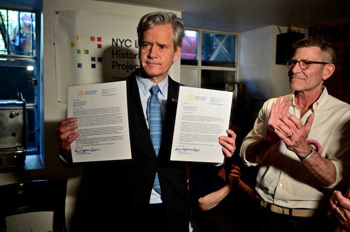 Manhattan Borough President Brad Hoylman-Sigal holds the two letters he wrote — one to the governor and one to the mayor — about Eve Adams.