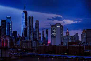 The sun sets behind the Manhattan skyline as the United States celebrates its 250th anniversary on Independence Day in New York City, U.S., July 4, 2026.