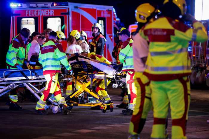 Emergency responders work on the site, after the annual Berlin's Christopher Street Day Pride parade was called off, after a car crashed into the crowd at Tiergarten park in Berlin, Germany, July 25, 2026. 